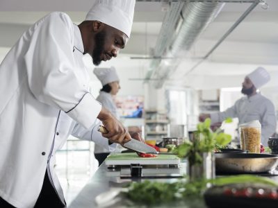 Head chef in restaurant professional kitchen preparing delicious meal